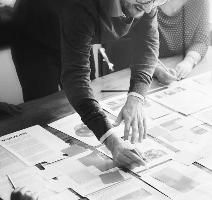two people analysing charts